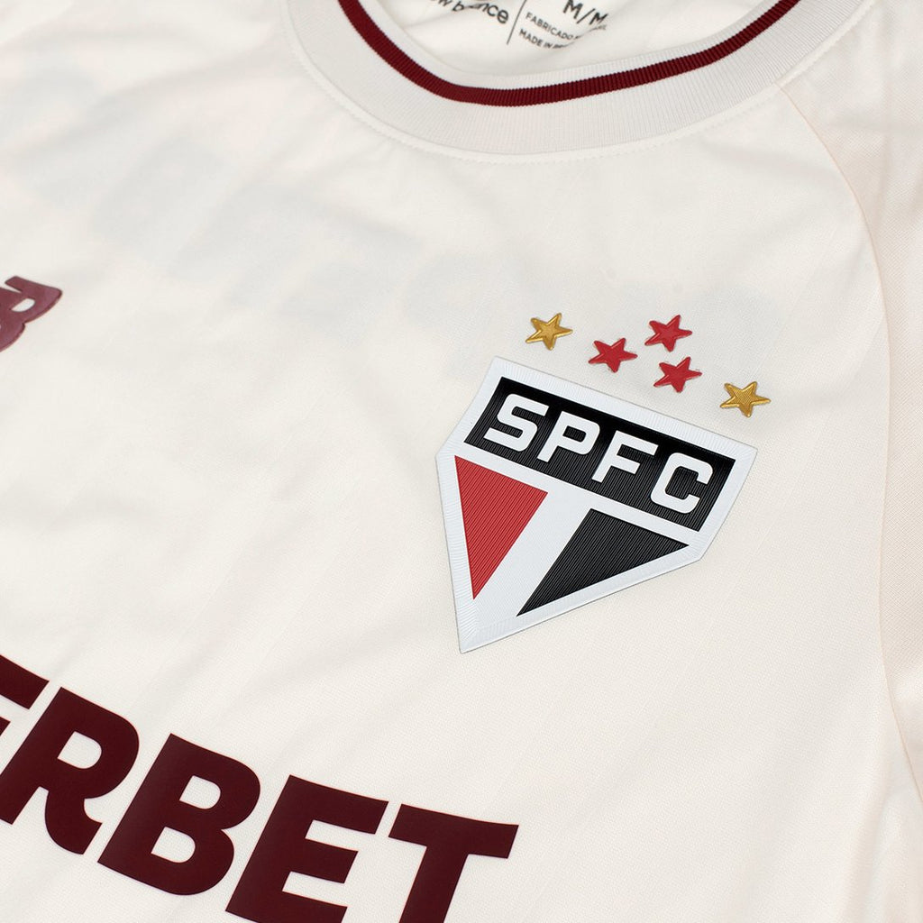 Camisa São Paulo Comemorativa 26/27 Torcedor New Balance Feminina Off White 39V-264J-701